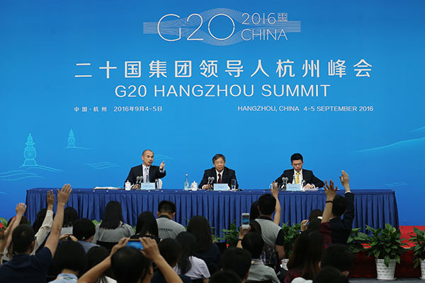 Yi Gang, vice-governor of People`s Bank of China, answers questions at a press conference on Sept. 2, 2016, prior to the G20 Leaders Summit to be held in Hangzhou, Zhejiang Province. 